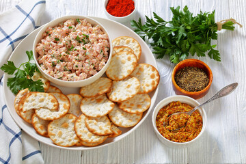 classic ham salad with crackers on white plate