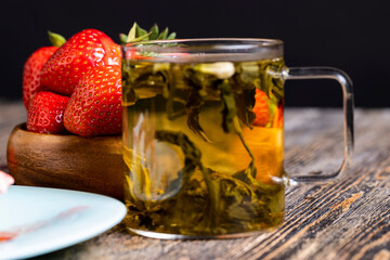 Brewed green tea with jasmine on the table