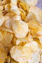 scattered potato chips with natural spices