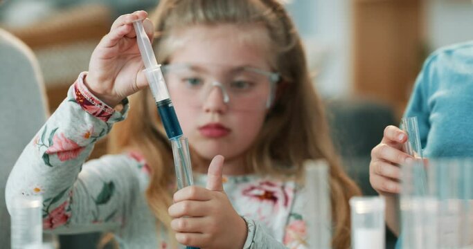 Children, learning and science tools at home for physics knowledge and education during lesson. Curious little girl kid playing with blue liquid for fun chemical experiment and happy development