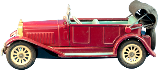 Vintage red metal toy antique car with convertible top isolated.