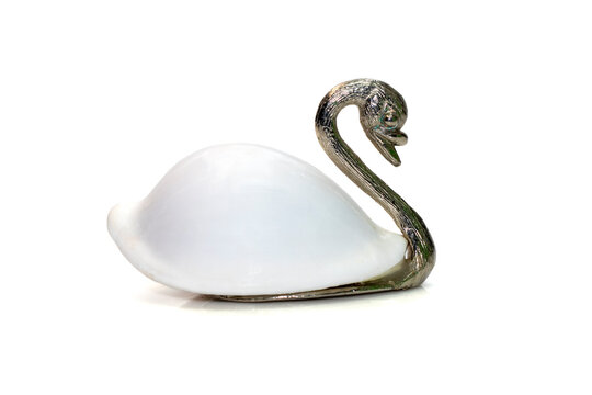 Image of swan sculpture with white shells(Ovula ovum) as part of its body. isolated on white background. Home decoration.