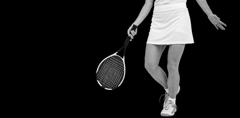 Low section of woman with tennis racket