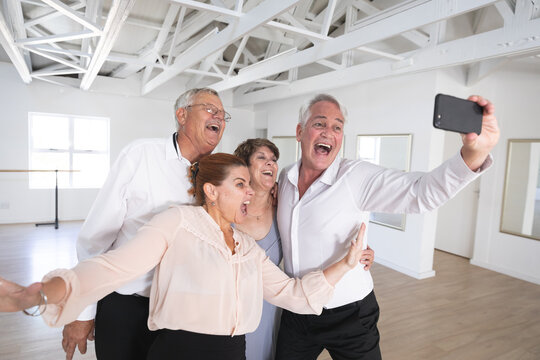 Happy Caucasian senior couples taking selfies during ballroom dancing - Powered by Adobe