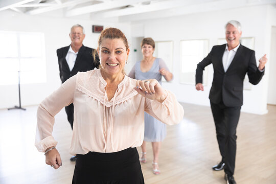 Happy Caucasian senior couples ballroom dancing