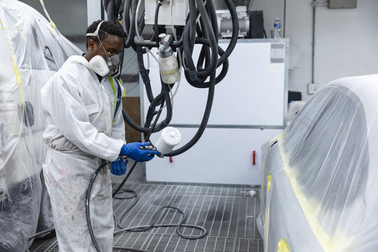 African American man car painter on work