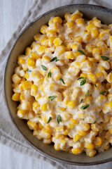 Homemade Slow Cooker Creamed Corn in a Bowl, top view. Flat lay, overhead, from above.