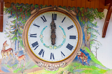Fototapeta na wymiar this house wall is a clock cuckoo clock from the Black Forest