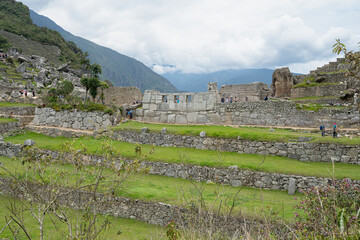 Machu picchu, pre columbian inca site situated on a mountain ridge above the urubamba valley in Peru.