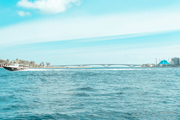 Obraz premium he Maldives and skyscrapers, transfer from the airport to the Islands by boat