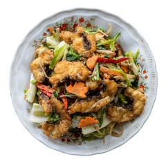 Isolate, top view, close-up, stir-fried fish with delicious vegetables in a dish, a popular local dish in rural Thailand.