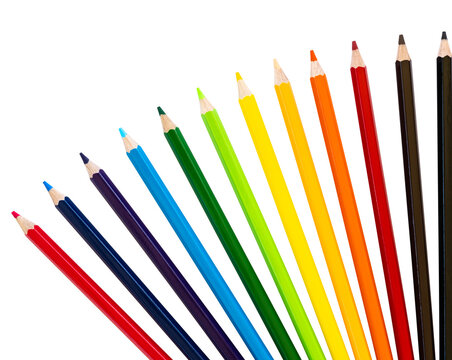 Background isolates of colored pencils in a variety of beautiful colors arranged in a semicircle like a fan against a white background.