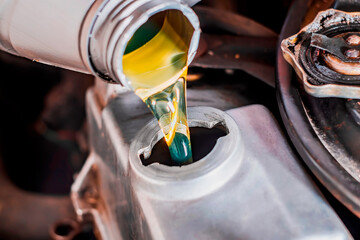 I pour the engine oil into the engine