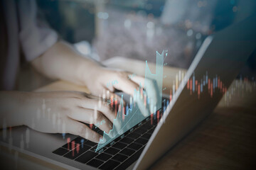 Fototapeta premium Business analytics and financial concept, Plans to increase business growth and an increase in the indicators of positive growth in 2022 floating above digital laptop computer