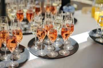 Alcoholic beverages at a wedding. Glasses and drinks at an event.