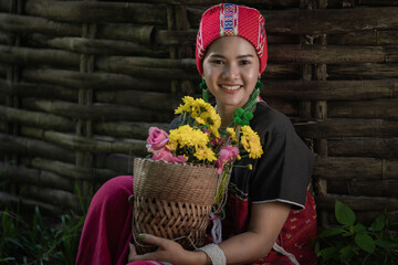Beautiful Asian young tribal lady in the native traditional dress culture of Karen people minority...