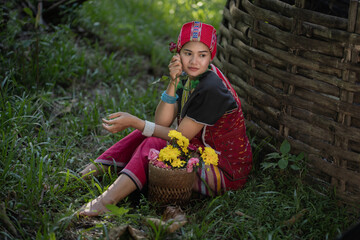 Beautiful Asian young tribal lady in the native traditional dress culture of Karen people minority...