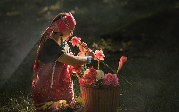 Beautiful Asian young tribal lady in the native traditional dress culture of Karen people minority ethnic culture. Portraits of identity dress folk applying fashion concepts.