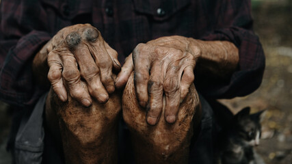 Male wrinkled hands, old man is wearing.