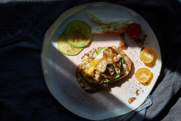 homemade delicious toast, topped with egg, summer squash, salmon and bonito