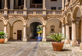 Fototapeta na wymiar Palermo, Italy - July 6, 2020: Courtyard of Palazzo dei Normanni (Palace of the Normans, Palazzo Reale) in Palermo city. Royal Palace was the seat of the Kings of Sicily during the Norman domination