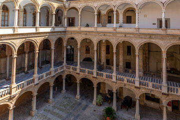 Fototapeta premium Palermo, Italy - July 6, 2020: Courtyard of Palazzo dei Normanni (Palace of the Normans, Palazzo Reale) in Palermo city. Royal Palace was the seat of the Kings of Sicily during the Norman domination