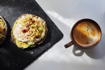 homemade delicious toast, topped with egg, tuna, cucumber and avocado