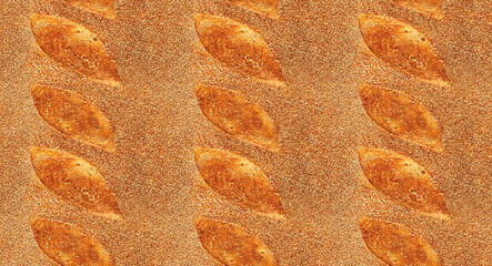 Pattern texture repeating seamless. Homemade fresh crunchy sourdough bread. Background. Сlose up view from top. Proper nutrition. Texture of baked crust of healthy whole wheat bread. Bakery