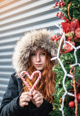 Young girl eating candy at christmas