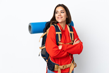 Young caucasian mountaineer girl with a big backpack isolated on white background laughing