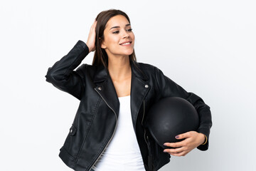 Caucasian girl holding a motorcycle helmet on white background laughing