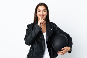 Caucasian girl holding a motorcycle helmet on white background doing silence gesture