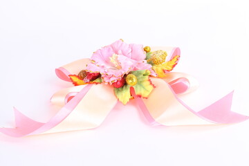 Pink satin gift bow. Ribbon. on white background