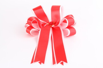Red satin gift bow. Ribbon. on white background