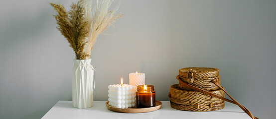 Banner for design. Home interior decor in beige neutral colors. White dresser with dried flowers in...