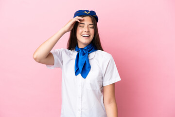 Airplane stewardess Brazilian woman isolated on pink background has realized something and intending the solution