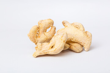 Dried ginger root on white background isolated. Indian spices close up.