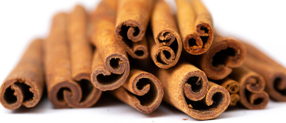 Cinnamon sticks on white background isolated. Indian spices close up. Medicinal herbs and spices.