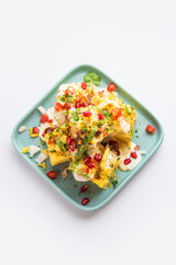 Khaman Dhokla chaat is a very simple and refreshing fusion chaat recipe made using leftover dhokla