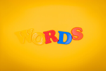 Words letters on yellow background. Illustration. Space fpr text