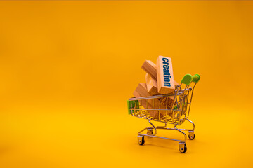 Construction price concept. Shopping cart full of sawmill construction materials standing on yellow...