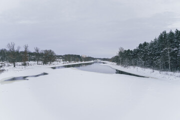 Naklejka premium Almost frozen river Gauja. Location of the picture Valmiera city.