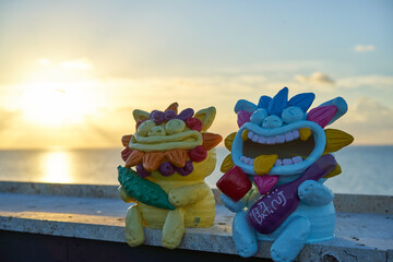 okinawa dragon statue and sun set