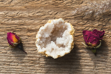 Quartz in Geode mineral stone with dry roses