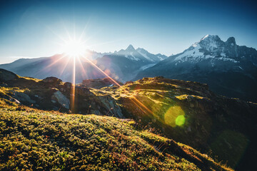 A panoramic view of a large mountain massif on a sunny day. Graian Alps, France, Europe.