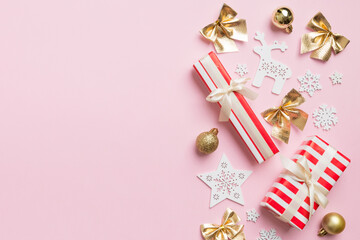 New Year composition. Christmas decor background with gift boxes. Top view with copy space