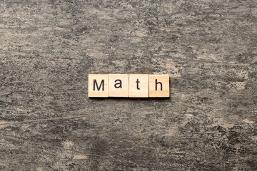math word written on wood block. math text on table, concept