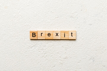 Brexit word written on wood block. Brexit text on cement table for your desing, concept