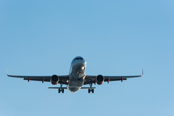 Passenger airplane on approach to the airport landing - stock photo