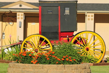 Old Amish carriage outdoor with flowers